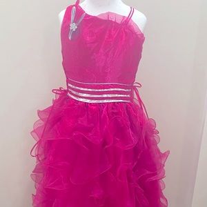 A long hot pink dress, with one strap shoulder, it’s in amazing condition.